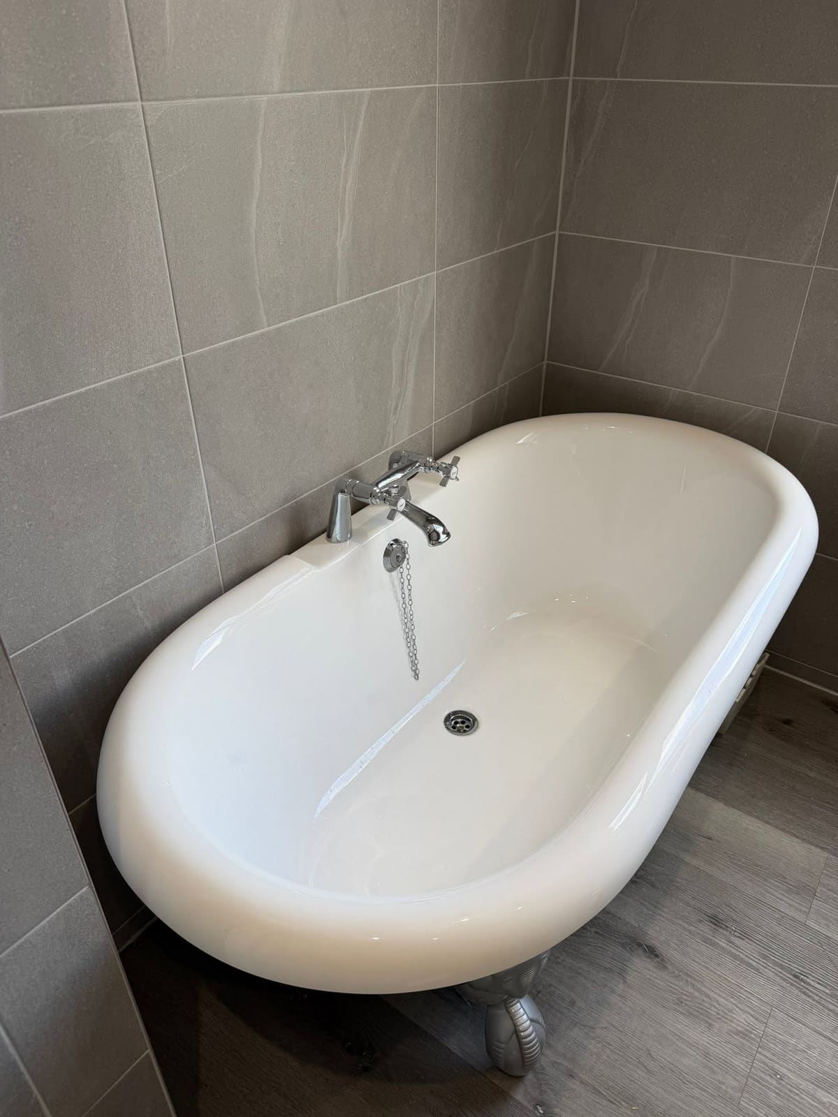 A roll-top bath in a bathroom Graham moved into a different room of the house